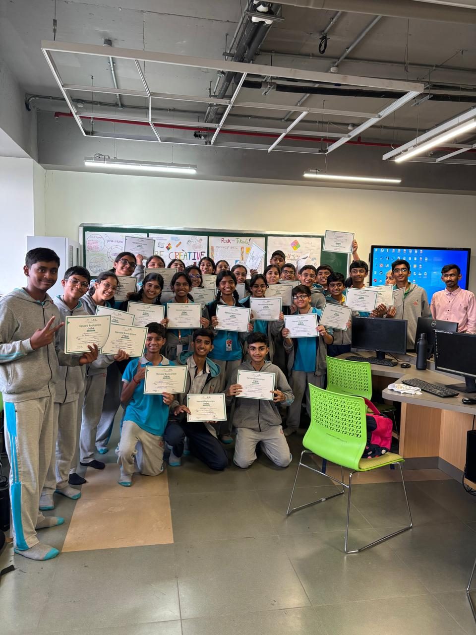 A bootcamp cohort holding the certificates they earned