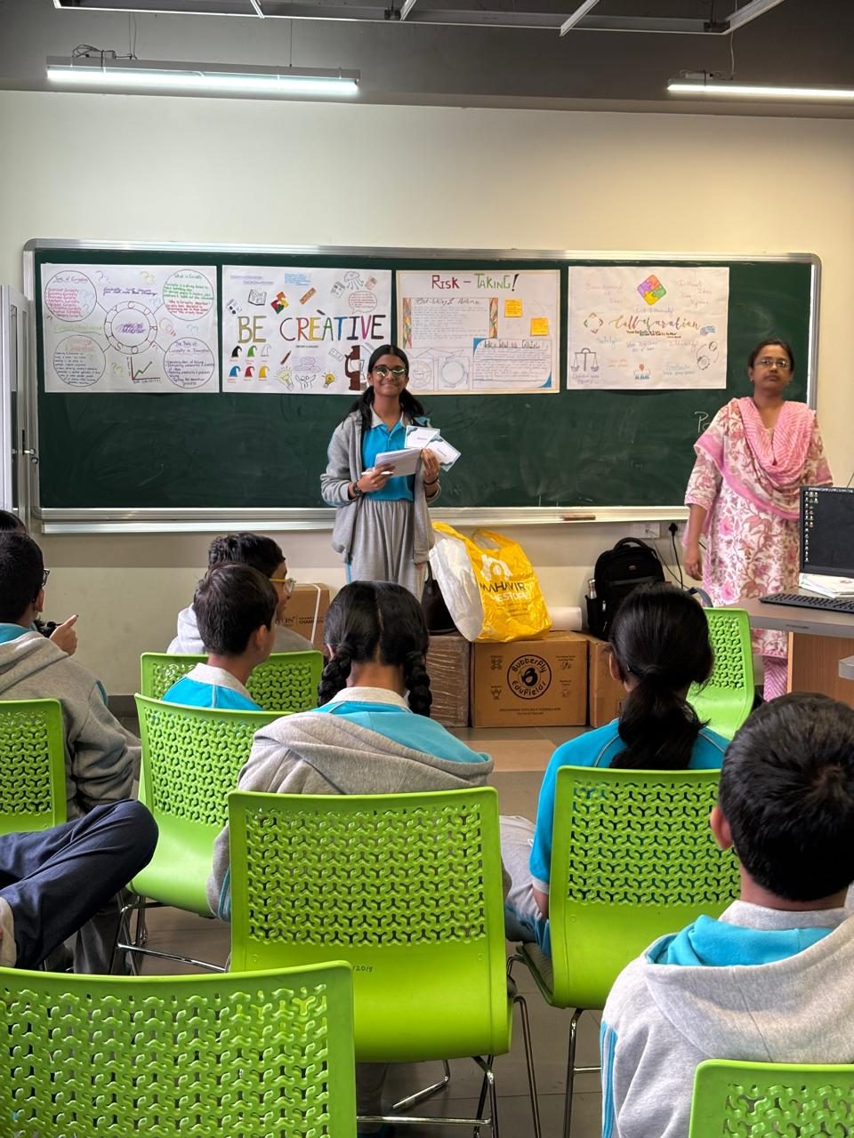 A student presenting her team's position to the room