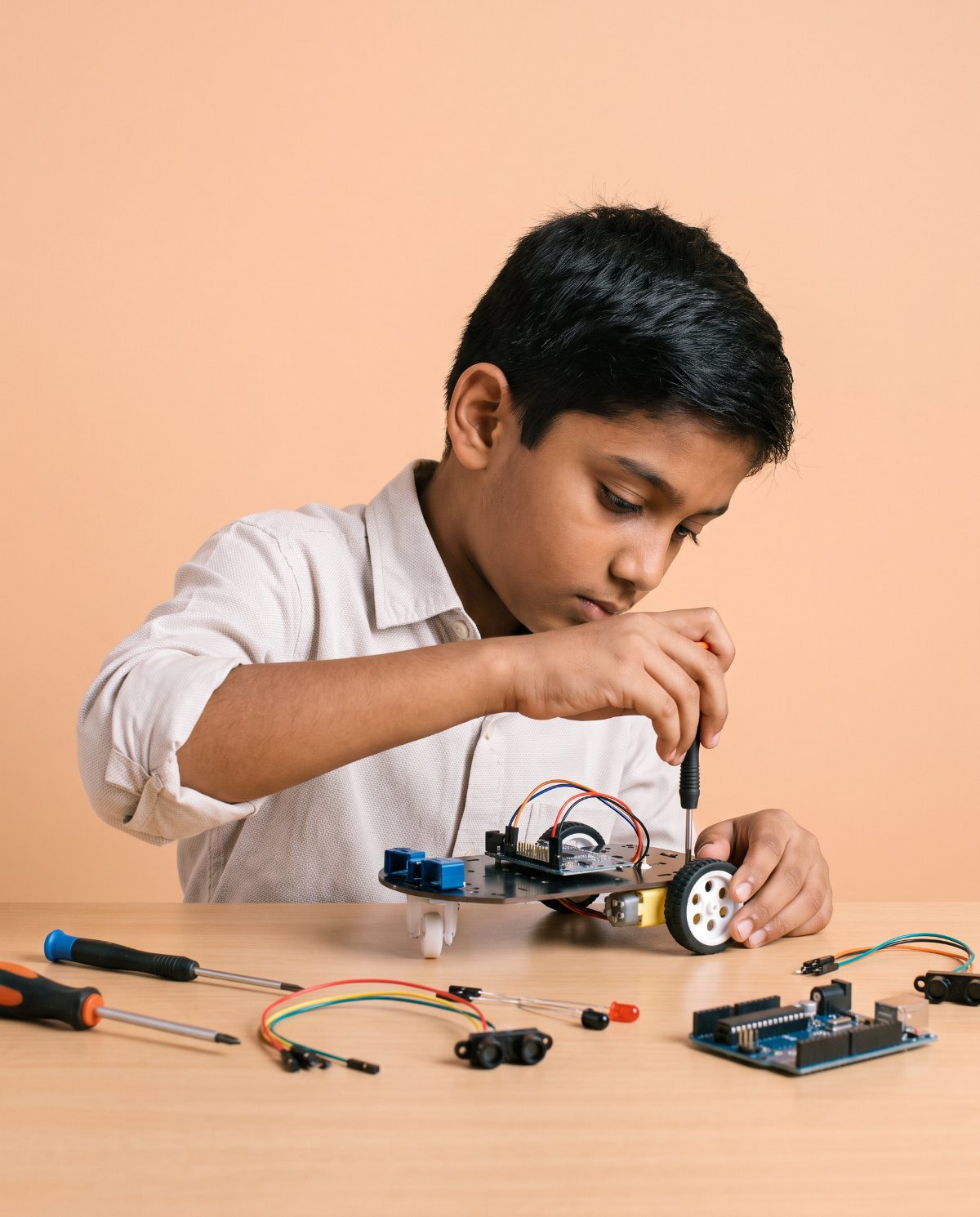 A student watching the LED matrix they programmed light up