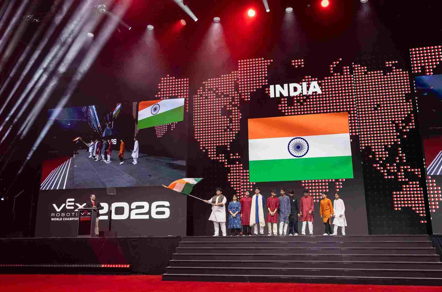 Team India on stage at the VEX Robotics World Championship 2026, with the Indian flag on the arena screen