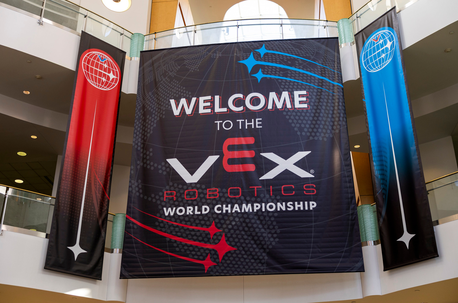 The welcome banner for the VEX Robotics World Championship in the venue atrium
