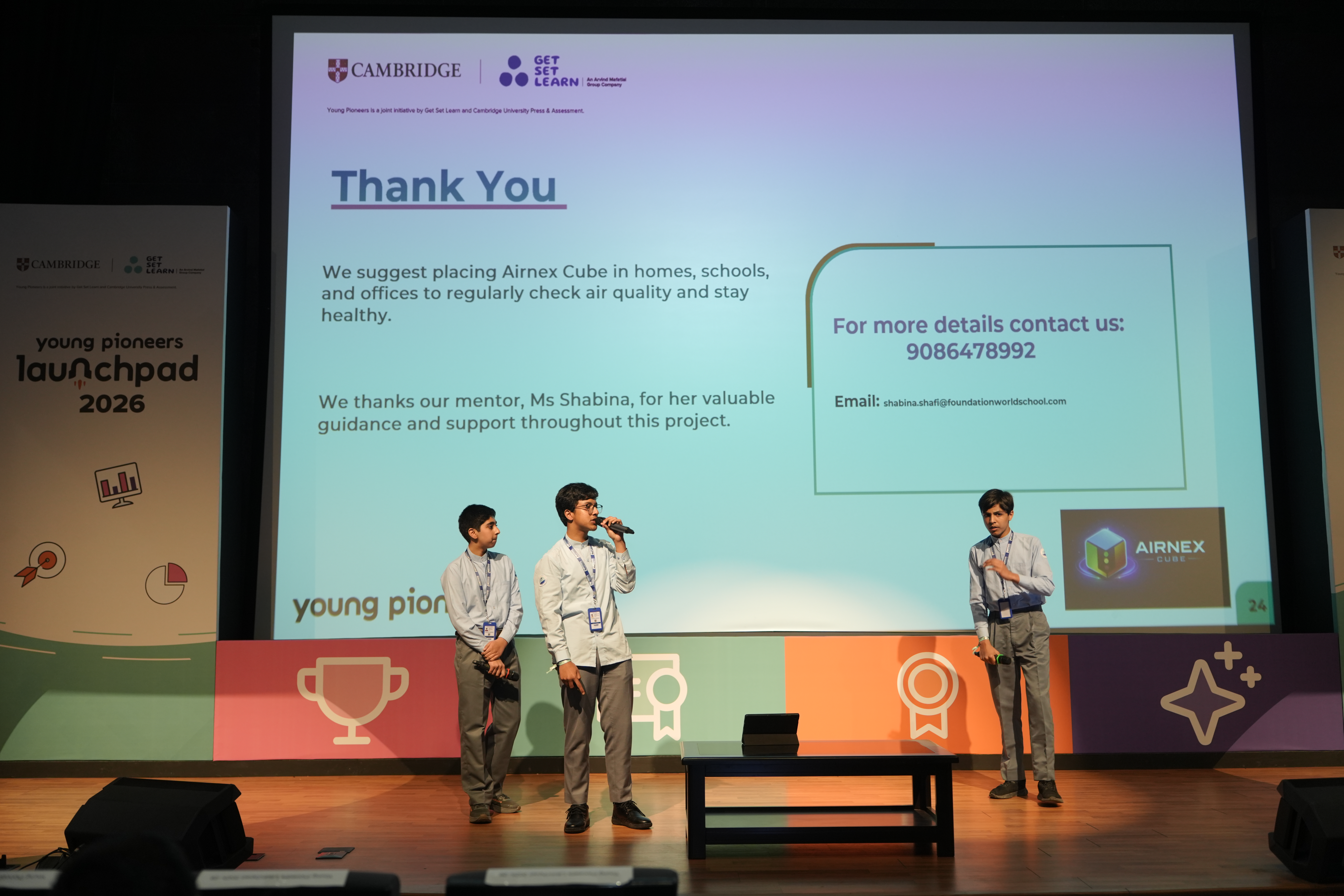 A student team closing their pitch and thanking their school mentor